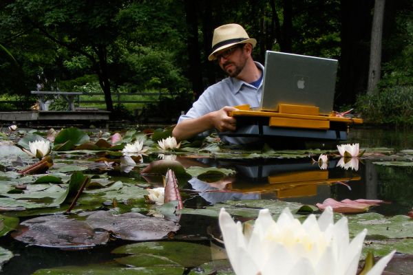 Click the image for a view of: Nathaniel Stern scanning in the lily pond